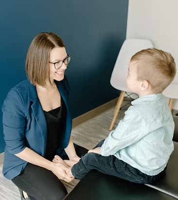Origin practitioner providing hands-on care