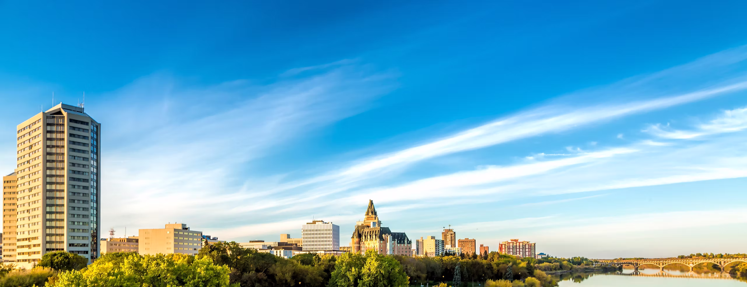 Saskatoon skyline under a blue sky